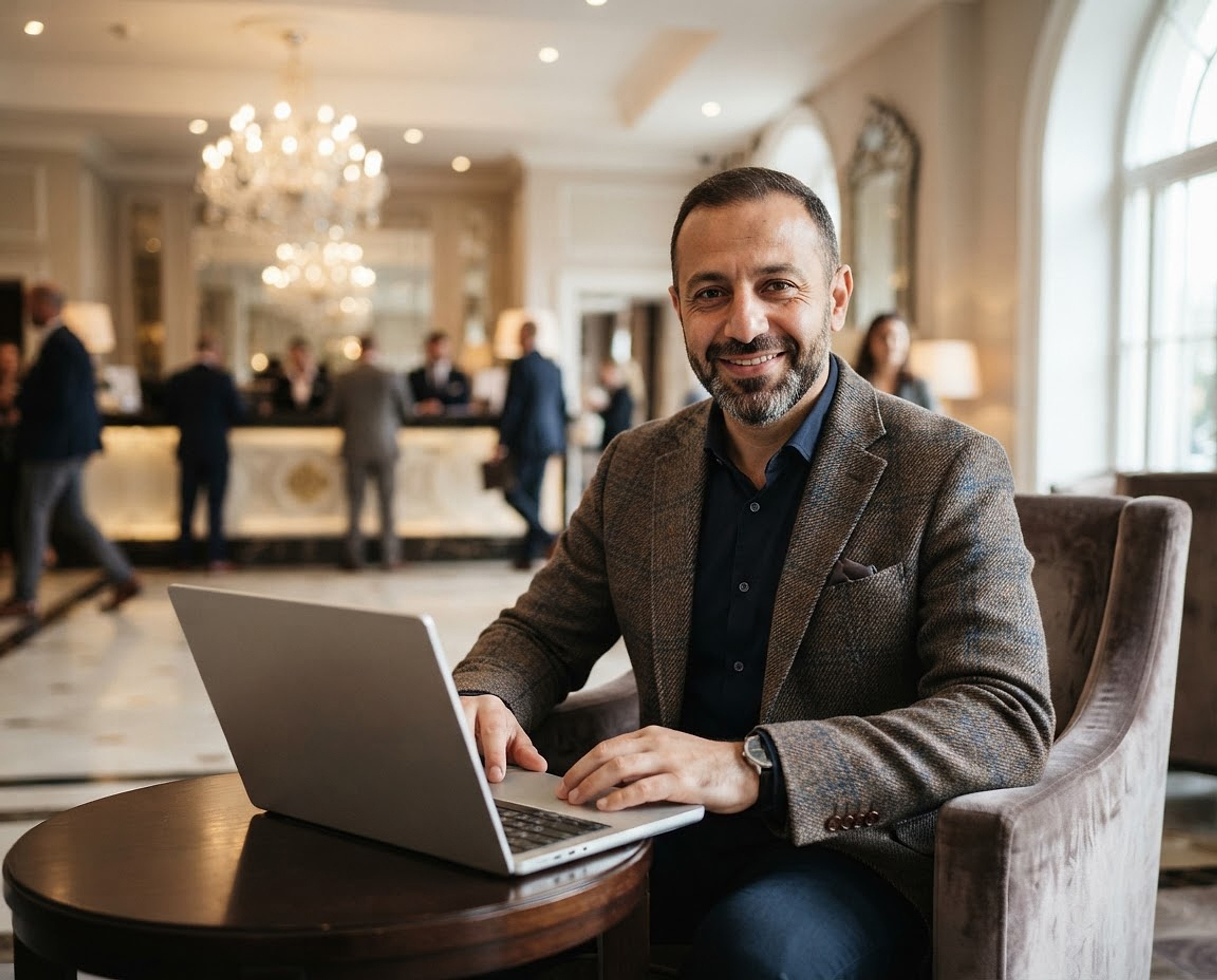Concept image: a hotel technology consultant in the lobby lounge